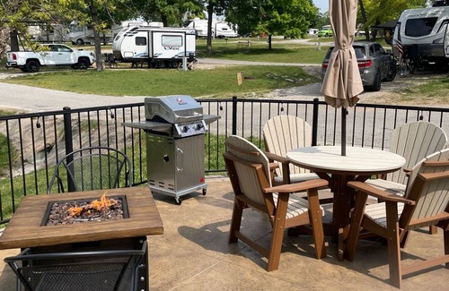 Branson Cottage | Oregon Trail Wagon has two queens size bed, bathroom w/shower, heat & a/c, smart tv, wi-fi, microwa