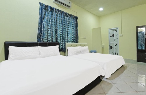 Paka Hotel | OYO 90596 Casaria Inn