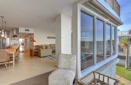 Port Aransas Condo | Panoramic views of the ship channel & private fishing pier from living room!