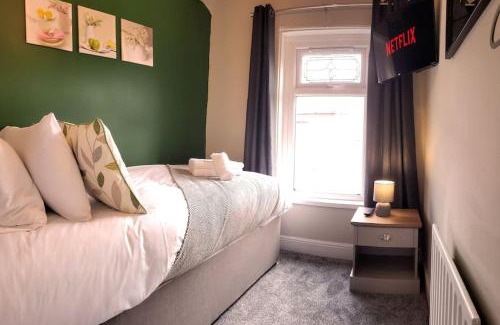 Port Talbot Apartment | Parking, 4 Bedrooms, Small Courtyard