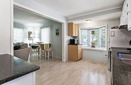 Lakeside House | Peaceful Pastel - Cheerful Cottage Close to Pere Marquette and Muskegon Lake - Pet Friendly