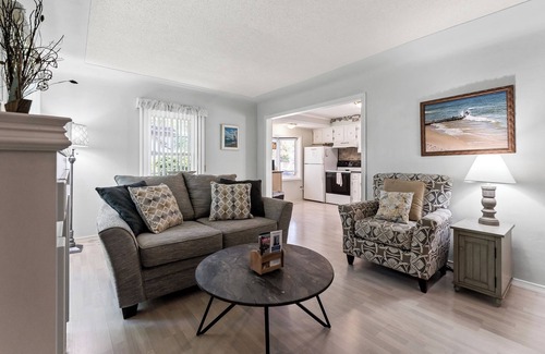 Lakeside House | Peaceful Pastel - Cheerful Cottage Close to Pere Marquette and Muskegon Lake - Pet Friendly