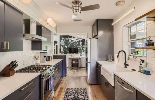 Parrot Cove House | Peacock Oasis - Retro Vibes and Poolside Lounging in Parrot Cove