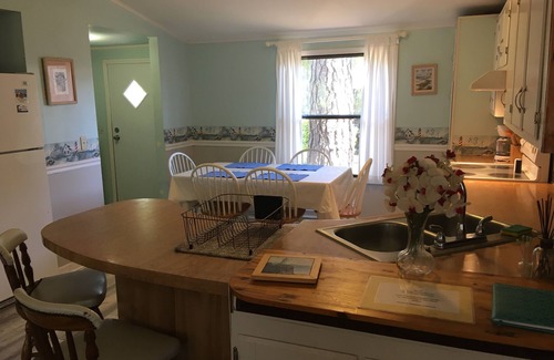 Ocean Isle Beach Cottage | Pet friendly, 3 bedroom, 2 bath, 2 piers, boat ramp, large porch, yard, waterway