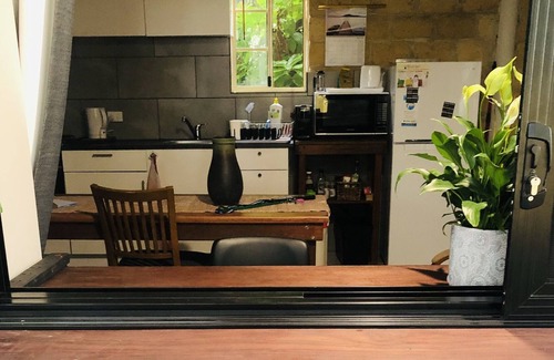 Bonny Hills Condo | Pet friendly covered courtyard with private studio