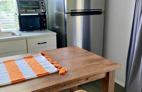 Eustis Cottage | Pine Forest Studio, serene winding lane to cozy retreat.