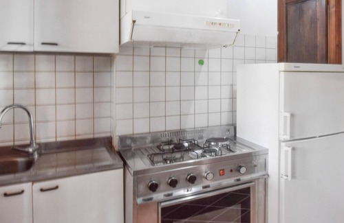 Praia a Mare Apartment | Practical apartment with open terrace and communal pool.