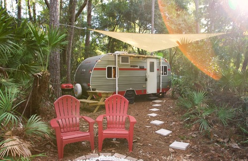 St. Augustine House | Priscilla's Hideaway. A beautiful retro camper in your own private pine forest.