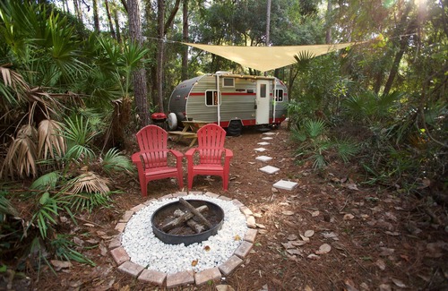 St. Augustine House | Priscilla's Hideaway. A beautiful retro camper in your own private pine forest.