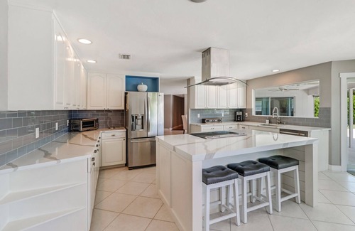 Palm River Estates House | Pristine Lake Home, Heated Pool, Gas Fire Pit, Fenced Yard