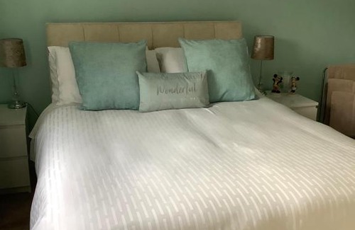 Bournemouth House | Private room, shared bathroom with one other, tea and coffee making facilities, mini fridge and hairdryer, King sized bed with help yourself continental breakfast in Secluded Modern Property with Parking