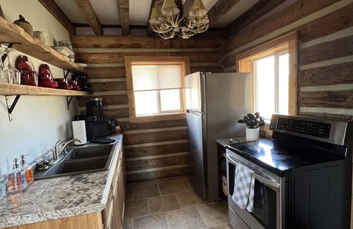 Hallsville Cabin | Quiet Cabin on Walnut Creek, Covered Deck, Hot Tub, Swimming Hole, Shelter House