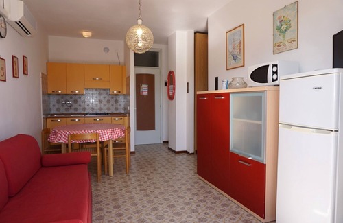 Porto Santa Margherita Apartment | Red flat with shared pool and private parking