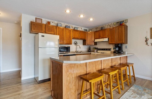 Village of Four Seasons Condo | Reel Relaxin - Waterfront Pool, Indoor Pool & Hot Tub!