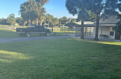 Palm City Cabin | Relax by the fire at The SmokenHouse cottage at the Ryan Holmes Ranch!