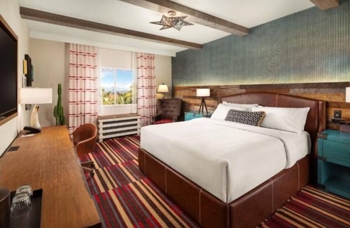 Enterprise Hotel | Relax in Comfort with a King Bed and Stunning Poolside Views