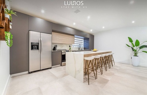 Richmond West House | Relax in Style: Pool, Golf, Luxe Kitchen, Sleeps 12