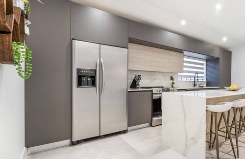 Richmond West House | Relax in Style: Pool, Golf, Luxe Kitchen, Sleeps 12