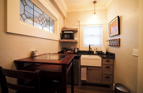 Historic Downtown District Apartment | Relax in the luxurious 1-bedroom Louisa Suite at RedTail Inn. Enjoy a double rain shower, plush linens, and a shared hot tub. Located near downtown Ashland, with off-street parking and high-speed WiFi.