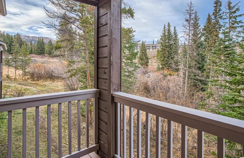 Wildernest Condo | Relax on the Deck with Red Mountain Views. Centrally Located Near Skiing, Trails, Dining & More!