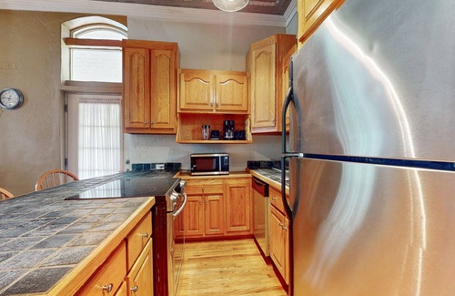 Whittier House | Relax riverside at this serene mountain getaway, complete with modern comfort.