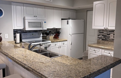Tequesta Condo | Resort style condo, Ground level w garage, 5 min to beach, heated pool
