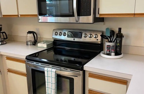 Pebble Beach House | Retreat with Screened Heated Pool Overlooking the Golf Course 3BR/2BA