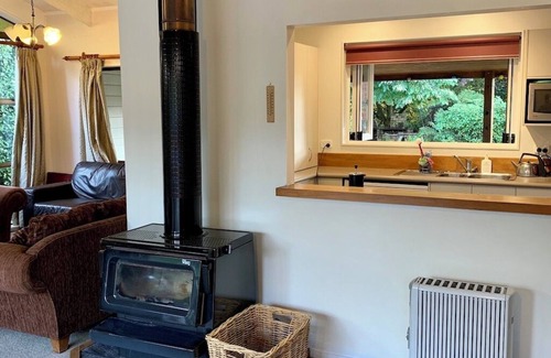 Broadlands Forest House | Riverside accommodation which is perfect for groups. Pizza oven, covered deck.
