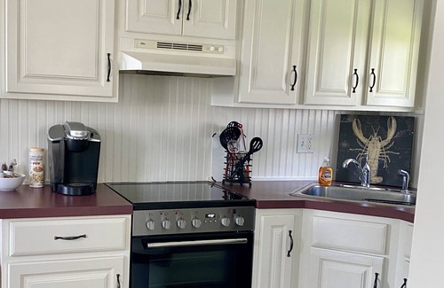 Clinton Cottage | Romantic Cottage by the Sea, steps to private beach, sleeps 2!