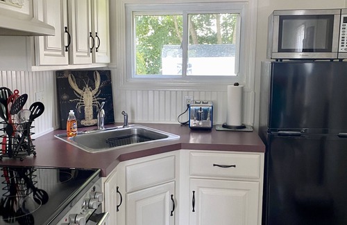 Clinton Cottage | Romantic Cottage by the Sea, steps to private beach, sleeps 2!