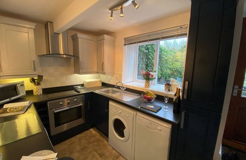 Monyash Cottage | Romantic Cottage for two In Monyash, with exposed beams and log-burning stove.