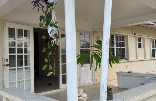 Clermont House | Room to Rent in Budget Friendly Bungalow with Island Breeze & Tropical Orchard