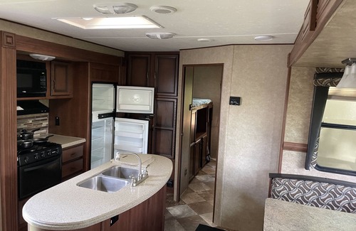 Saint Mary Of The Woods RV Rental | RV on a lake in a campground. Great for parties