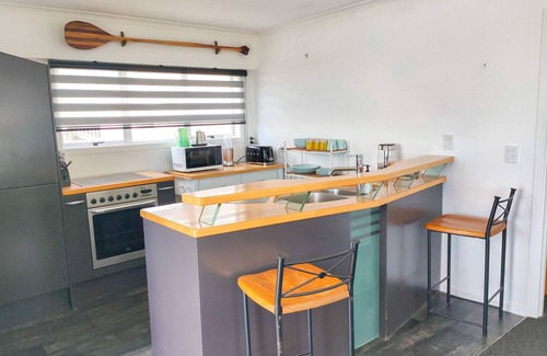 Pukehina House | "Salty Dog Beach Bach" is a comfortable and no-frills beachfront retreat.