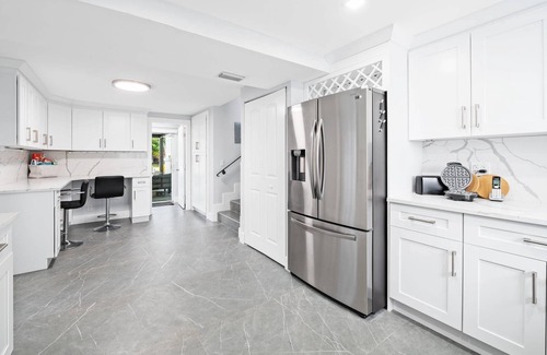 Lauderdale Isles House | Secluded Canal Sanctuary: Private Beach, Boat Dock, Pool, Mini-Golf Extravaganza