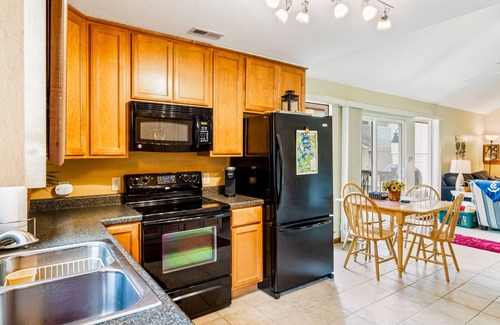 Sunrise Beach Cabin | Secluded lakefront home with private dock, firepit, grill, water views, hammock