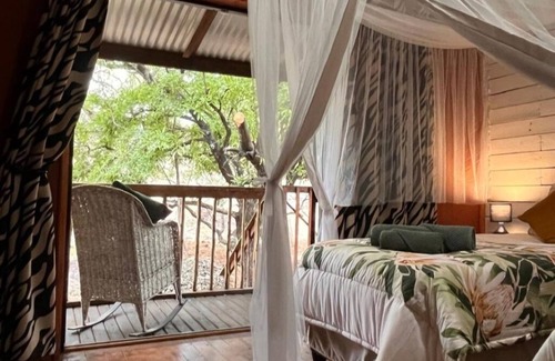 Marloth Park Cabin | See the Big 5 from the viewing deck of this incredible riverside bush lodge!