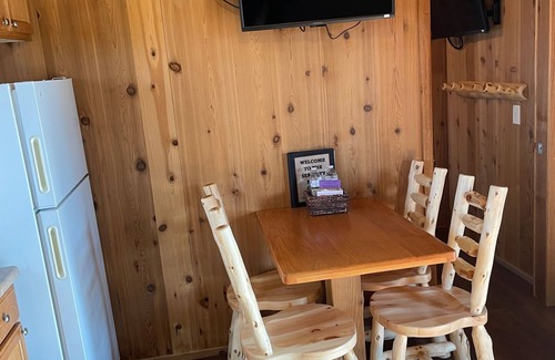 Branson Cottage | Serenity Falls Cabin includes 2 bedrooms (1 with a queen size bed and 1 with a full size bed), 1 fut