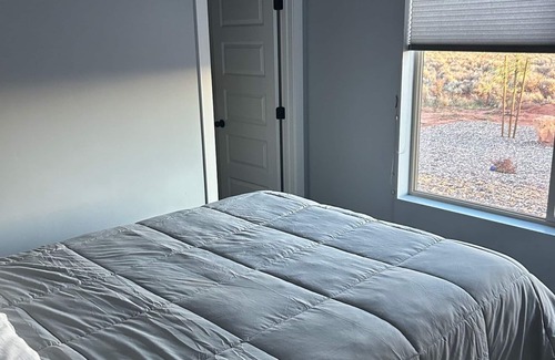 Kanab Bed & Breakfast | Shared space with owners. 2 bedroom and bath, swim spa, golf green,great views.