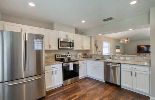 Sandalwood House | Single-story home with lagoon view, garden patio & easy drive to the beach