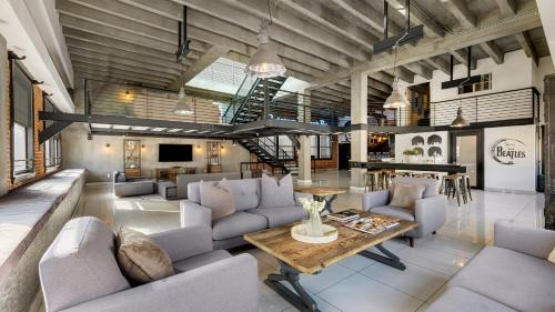 Historic Core House | Skyline Lofts by AvantStay: a multi-level industrial-chic retreat in DTLA with rooftop views soaring ceilings steps to dining music culture