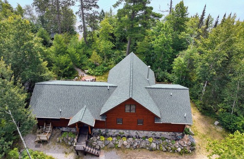 Cook House | Snowmobile Retreat with Trailer Parking, Screen Porch, Sauna, 3 Bedrooms & Loft.