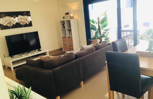 Gran Tarajal Apartment | Spacious Apartment, Panoramic Sea and Mountain Views, Gym, Pool, WiFi, Smart TV