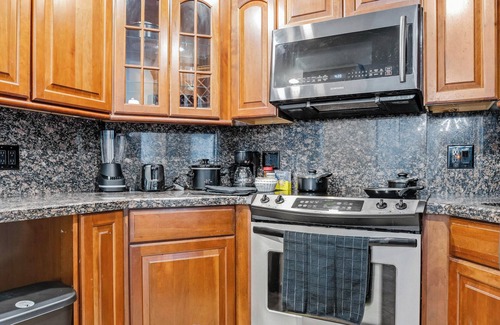 Bermuda Riviera Condo | Spacious Beach Retreat - Private Beach - Pool & Tiki - Ping Pong & Hockey Table