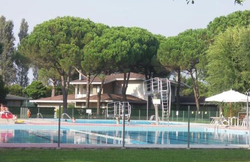 Bibione Apartment | Spacious flat with fenced garden and fireplace