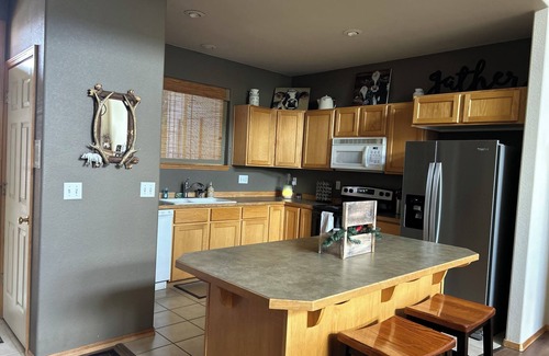 Redmond House | Spacious home with private deck, shared pool, and many resort amenities