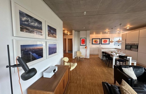 Neuharlingersiel House | Spacious modern vacation home on the canal in Nordic design