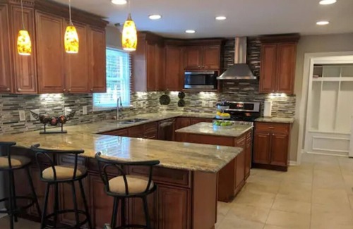 West Chester House | Splash and Soak Oasis with Pool and Hot Tub