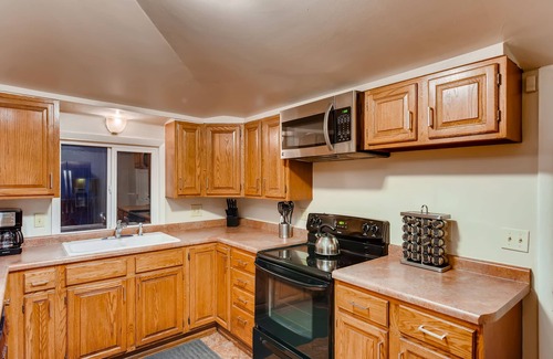Central Colorado Springs House | Sport Themed Stay — Downtown, Family Fun, Full Kitchen, Parks, Foosball, W/D