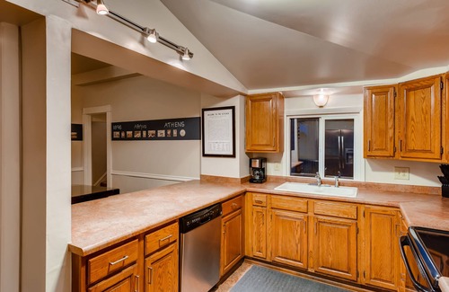 Central Colorado Springs House | Sport Themed Stay — Downtown, Family Fun, Full Kitchen, Parks, Foosball, W/D